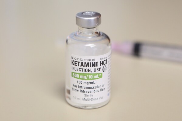 FILE - A vial of ketamine is displayed for a photograph in Chicago on July 25, 2018. An investigation by The Associated Press has found that at least 15 people died in Texas in 2012-2021 following physical encounters with police during which medical personnel also injected them with a powerful sedative. The practice spread nationally over the last 15 years, built on questionable science and backed by police-aligned experts. (AP Photo/Teresa Crawford, File)