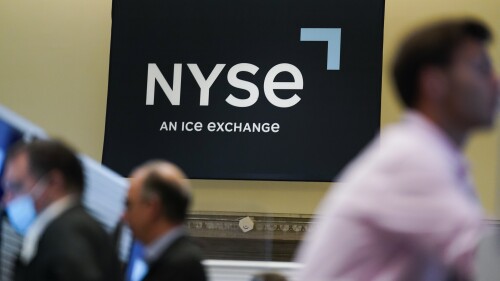 FILE - An NYSE sign is seen on the floor at the New York Stock Exchange in New York, Wednesday, June 15, 2022. (AP Photo/Seth Wenig, File)