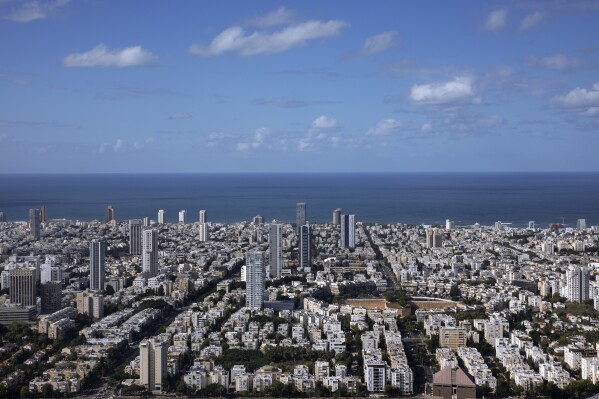 FILE - A general view shows the center of Tel Aviv, Israel, Thursday, Dec. 2, 2021. Prime Minister Benjamin Netanyahu has vowed to shut down Al Jazeera’s operations in Israel, calling it a “terror channel” that spreads incitement, after parliament passed a law clearing the way for the closure. (AP Photo/Oded Balilty, File)