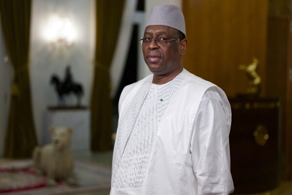 FILE - Senegal President Macky Sall poses before an interview with The Associated Press at the presidential palace in Dakar, Senegal, Feb. 9 , 2024. Senegal will hold elections as soon as possible given that the country's top election authority has overturned a decree by President Sall to postpone the vote, the government said Friday, Feb. 16, 2024. (AP Photo/Sylvain Cherkaoui, File)