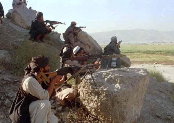 Taliban militants take position at the outskirt of Laghman province of Afghanistan Friday, Sep 13, 1996. Afghan government troops retreated from eastern Afghan province of Laghman after the rebel force on Friday overran the provincial capital and captured several key districts. (AP Photo/Haider Shah)