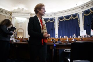 Former U.S. Ambassador to Ukraine Marie Yovanovitch gets up during a break in testimony before the House Intelligence Committee, Friday, Nov. 15, 2019, on Capitol Hill in Washington, in the second public impeachment hearing of President Donald Trump's efforts to tie U.S. aid for Ukraine to investigations of his political opponents. (AP Photo/Jacquelyn Martin)