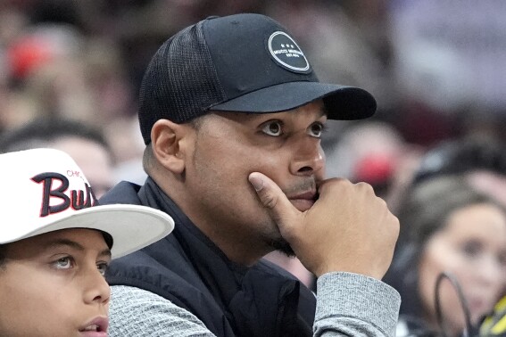 Chicago Bears general manager Ryan Poles watches during the second half of an NBA basketball game between the Indiana Pacers and the Chicago Bulls in Chicago, Wednesday, March 27, 2024. The Bulls won 125-99. (AP Photo/Nam Y. Huh)