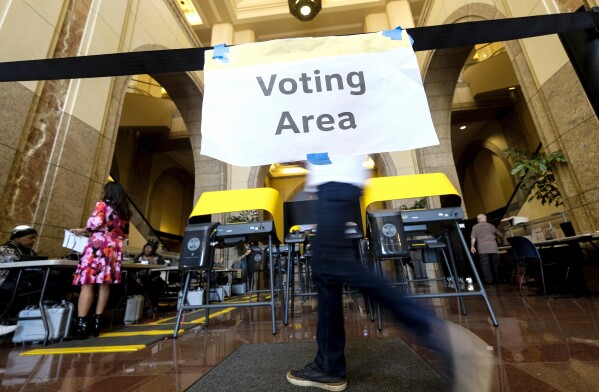 FILE - In this March 3, 2020 file photo, voters cast their ballots in the California Primary on Super Tuesday at a voting center at Union Station in Los Angeles. (AP Photo/Ringo H.W. Chiu, File)