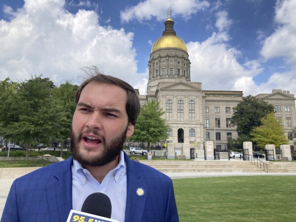 FILE - Georgia state Sen. Colton Moore, R-Trenton, speaks to reporters outside the Georgia Capitol in Atlanta, Sept. 7, 2023. Georgia House Speaker Jon Burns, R-Newington, banned Moore from the House floor on Thursday, March 14, 2024 after Moore attacked late House Speaker David Ralston as "corrupt" in a speech as both the House and Senate were honoring Ralston. (AP Photo/Jeff Amy, File)