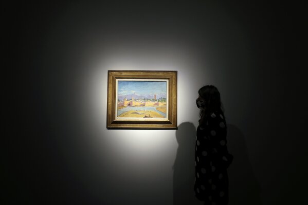 An oil on canvas painting by Sir Winston Churchill Painted in Jan. 1943 called 'Tower of the Koutoubia Mosque' is displayed at Christie's auction rooms in London, Friday, Jan. 29, 2021. The painting currently owned by Angelina Jolie, has an estimate of 1,500,000-2,500,000 UK pounds (2,056,489- 3,427,482 US Dollars) and will go up for sale in the Modern British Art Evening Sale at Christie's on March 1, 2021. (AP Photo/Kirsty Wigglesworth)