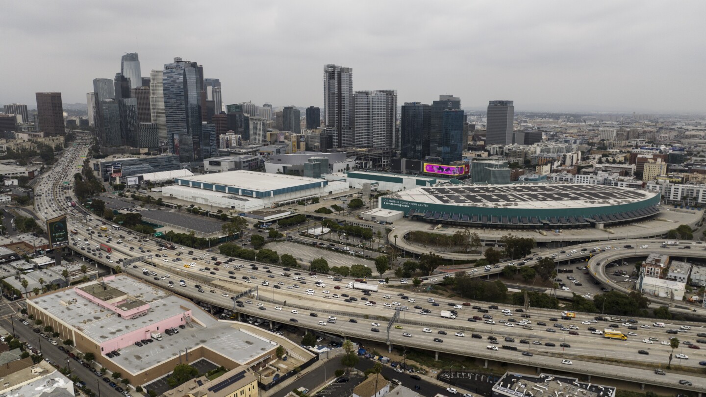 FILE - This aerial view shows traffic moving along the 110 Freeway past the Los Angeles Convention Center in Los Angeles, Tuesday, Sept. 5, 2023. As t