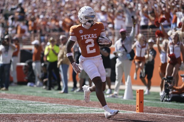 Texas wide receiver Matthew Golden (2) scores a touchdown against Florida during the first half of an NCAA college football game in Austin, Texas, Saturday, Nov. 9, 2024. (AP Photo/Eric Gay)