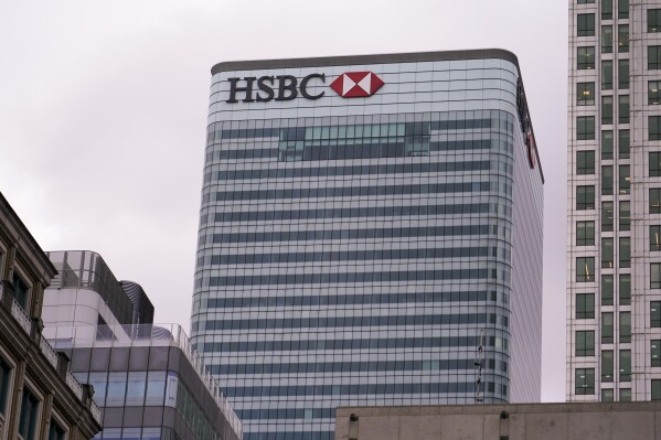 FILE - The HSBC headquarters stand in the financial district of Canary Wharf, in London, Monday, March 13, 2023. UK regulators say HSBC has been fined $72.8 million for failing to adequately protect customer deposits in the event the bank collapsed. (AP Photo/Alberto Pezzali, File)