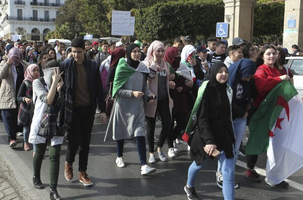
              High school students march in central Algiers, Sunday, March 10, 2019. The protesters are challenging President Abdelaziz Bouteflika's fitness to run for a fifth term in next month's election. (AP Photo/Anis Belghoul)
            
