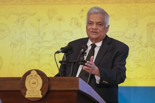 FILE- Sri Lankan President Ranil Wickremesinghe speaks during the 37th Session of the UN Food and Agriculture Organization (FAO) Regional Conference for Asia and the Pacific in Colombo, Sri Lanka, Feb. 20, 2024. Sri Lanka's president said Wednesday that he is seeking a loan repayment moratorium until 2028 as the debt-ridden county tries to emerge from bankruptcy. (AP Photo/Eranga Jayawardena, File)
