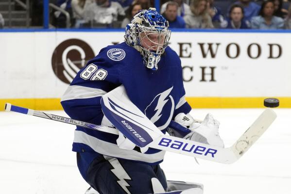 Tampa Bay Lightning goaltender Andrei Vasilevskiy (88) makes a save on a shot by the Colorado Avalanche during the third period of an NHL hockey game Thursday, Feb. 9, 2023, in Tampa, Fla. (AP Photo/Chris O'Meara)
