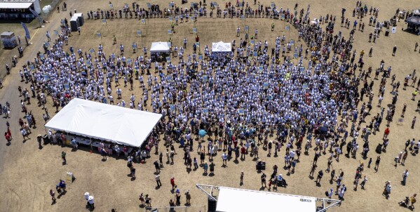 This photo taken by a drone and provided by the City of Kyle, Texas, shows an attempt by the city to break the world record for the largest gathering of people with one name, Saturday, May 18, 2024, in Kyle. (City of Kyle, Texas via AP)
