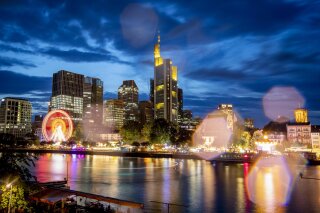 Raindrops on the camera lens reflect the lights of the Mainfest event at the river Main in Frankfurt, Germany, late Friday, Aug. 2, 2019. (AP Photo/Michael Probst)