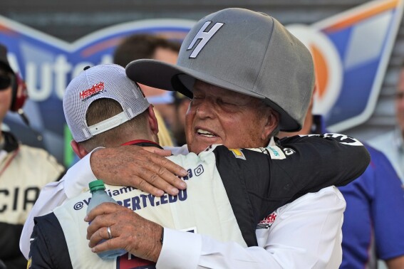 Team owner Rick Hendrick, right, hugs driver William Byron after he won the NASCAR Cup Series auto race at Texas Motor Speedway in Fort Worth, Texas, Sunday, Sept. 25, 2022. (AP Photo/Larry Papke)