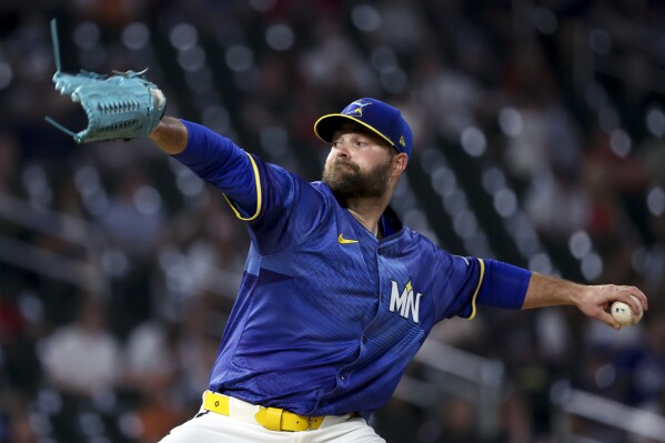 Minnesota Twins pitcher Danny Coulombe (54) throws to the San Francisco Giants during the ninth inning of a baseball game Friday, May 9, 2025, in Minneapolis. (AP Photo/Ellen Schmidt)
