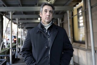 
              Michael Cohen, former lawyer to President Donald Trump, leaves his apartment building on New York's Park Avenue, Friday, Dec. 7, 2018. In the latest filings Friday, prosecutors will weigh in on whether Cohen deserves prison time and, if so, how much. (AP Photo/Richard Drew)
            