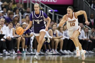 FILE - Kansas State guard Serena Sundell (4) is chased by Texas guard Shay Holle (10) during the first half of an NCAA college basketball game March 11, 2024, in Kansas City, Mo. Thirteenth-seeded Portland will take on Kansas State at the home of the No. 4 seed Wildcats in the first round of the women’s NCAA Tournament, with a match between No. 5 seed Colorado and No. 12 seed Drake following Friday night. (AP Photo/Charlie Riedel, File)