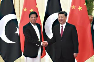 FILE - In this April 28, 2019, file photo, China's President Xi Jinping, right, shakes hands with Pakistan's Prime Minister Imran Khan before a meeting at the Great Hall of the People in Beijing. Pakistan and China are urging the international community to send humanitarian help to Afghanistan, where people are facing shortages of food and medicine in the shadow of winter. A government statement said Pakistani Prime Minister Imran Khan and Chinese President Xi Jinping discussed the situation in Afghanistan by phone(Madoka Ikegami/Pool Photo via AP, File)