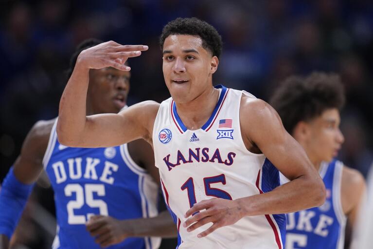 Kansas guard Kevin McCullar Jr. (15) celebrates a score against Duke during the first half of an NCAA college basketball game, Tuesday, Nov. 15, 2022, in Indianapolis. (AP Photo/Darron Cummings)