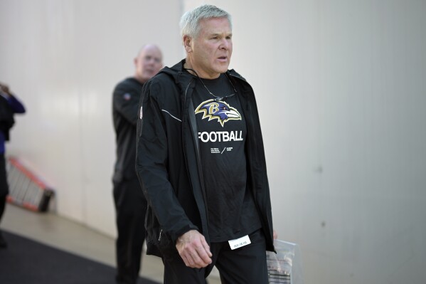 FILE - Baltimore Ravens offensive line coach Joe D'Alessandris walks to the field before an NFL football game against the Jacksonville Jaguars, Sunday, Nov. 27, 2022, in Jacksonville, Fla. (AP Photo/Phelan M. Ebenhack, File)