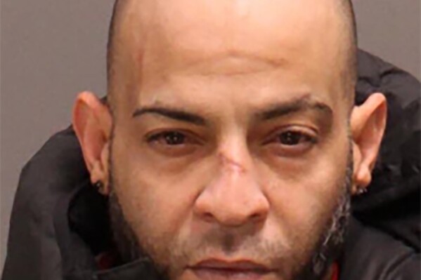 This undated photo provided by the Philadelphia Police Department shows Jose Quinones-Mendez. On Sunday, Jan. 28, 2024, authorities identified Quinones-Mendez as the man they allege fled a north Philadelphia corner store with a gun that had been used to wound a police officer after the shooter was fatally wounded by another officer. (Courtesy of Philadelphia Police Department via AP)
