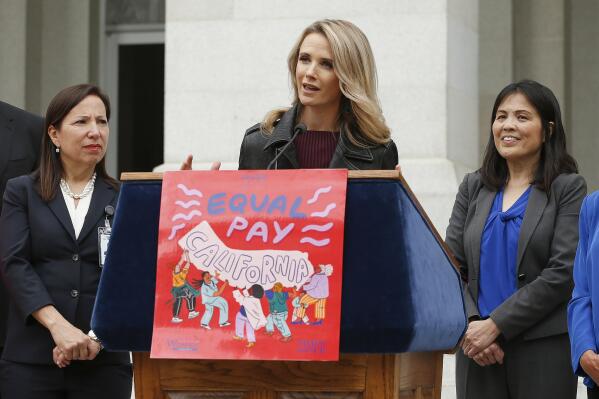 FILE - California first partner Jennifer Siebel Newsom, center, wife of Gov. Gavin Newsom, joined others to announce the #EqualPayCA campaign, in Sacramento, Calif., on April 1, 2019. Siebel Newsom, a documentary filmmaker and actor, is among the accusers of Harvey Weinstein who will testify at his rape and sexual assault trial that began Monday, Oct. 10, 2022, her attorney said.  (AP Photo/Rich Pedroncelli, File)