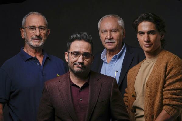 From left, Gustavo Zerbino, director J. A. Bayona, writer Pablo Vierci, and actor Enzo Vogrincic pose for a portrait to promote the film 