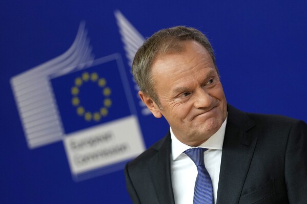 Leader of the Polish Civic Coalition Donald Tusk addresses a media conference prior to a meeting with European Commission President Ursula von der Leyen at EU headquarters in Brussels, Wednesday, Oct. 25, 2023. (AP Photo/Virginia Mayo)