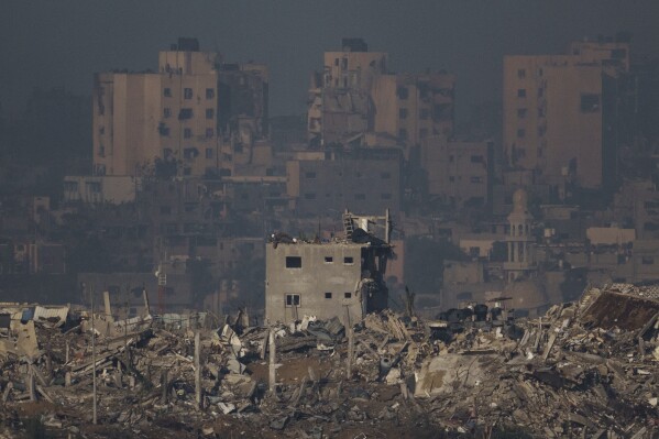 FILE - Destroyed buildings are seen in the Gaza Strip, as seen from southern Israel on Nov. 20, 2023. (AP Photo/Leo Correa, File)