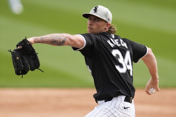 Chicago White Sox starting pitcher Michael Kopech (34) throws during the third inning of a spring training baseball game against the Los Angeles Dodgers in Phoenix, Wednesday, March 6, 2024. (AP Photo/Ashley Landis)