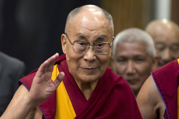 
              FILE - In this Sept. 15, 2018, file photo, Tibetan spiritual leader the Dalai Lama greets journalists during the opening of the exhibition titled "Buddha's Life" at the Nieuwe Kerk church in Amsterdam, Netherlands. The Dalai Lama has been hospitalised in the Indian capital with chest infection and is feeling much better. The Tibetan spiritual leader's spokesman Tenzin Taklha says the Dalai Lama is under medication and likely to spend a day or two in the hospital. The Dalai Lama flew to New Delhi from Dharmsala for consultations with doctors and was hospitaliszd on Tuesday, April 9, 2019. (AP Photo/Peter Dejong, File)
            
