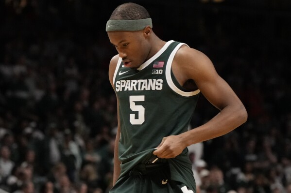 Michigan State guard Tre Holloman walks off the court after the second half in the Elite Eight of the NCAA college basketball tournament against Auburn, Sunday, March 30, 2025, in Atlanta. (AP Photo/Brynn Anderson)