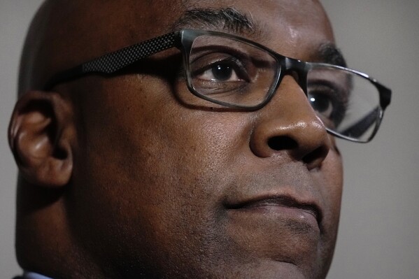 Kwame Raoul, Attorney General of Illinois, listens to a question during an interview at the State Attorneys General Association meetings , Wednesday, Nov. 15, 2023, in Boston. In exclusive sit-down interviews with The Associated Press, several Black Democrat attorneys general discuss the role race and politics plays in their jobs. (AP Photo/Charles Krupa)