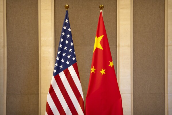 FILE - United States and Chinese flags are set up before a meeting between Treasury Secretary Janet Yellen and Chinese Vice Premier He Lifeng at the Diaoyutai State Guesthouse in Beijing, on July 8, 2023. China said the United States is the 