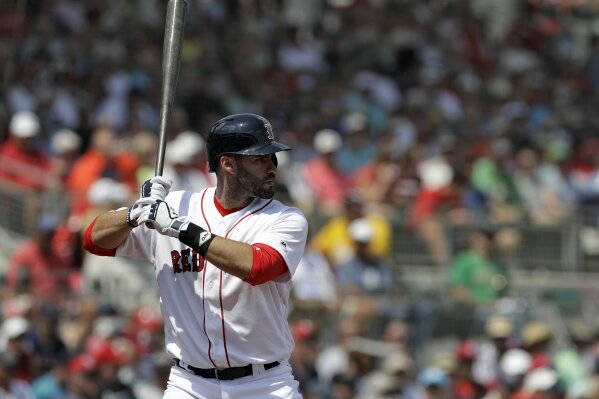 
              FILE - In this March 19, 2018, file photo, Boston Red Sox's J.D. Martinez bats against the Philadelphia Phillies during a spring training baseball game Monday, March 19, 2018, in Fort Myers, Fla. The Red Sox will top the major leagues with a payroll of about $223 million, after signing Martinez in the offseason. (AP Photo/Chris O'Meara, File)
            