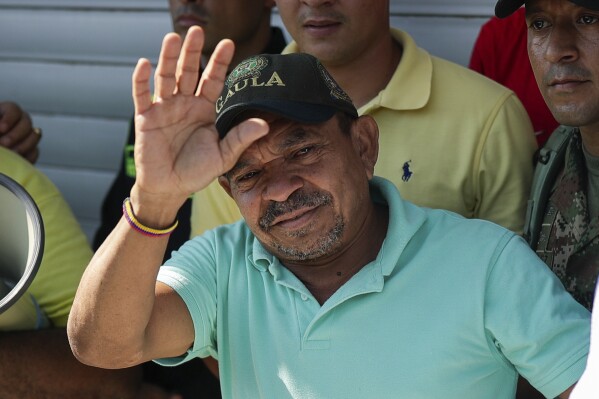 Luis Manuel Díaz waves to neighbors at his home in Barrancas, Colombia, after he was released by his kidnappers Thursday, Nov. 9, 2023. Díaz, the father of Liverpool striker Luis Díaz, was kidnapped on Oct. 28 by the guerrilla group National Liberation Army, or ELN. (AP Photo/Ivan Valencia)
