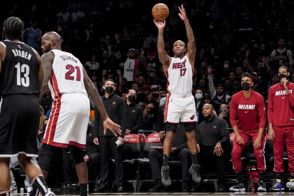 Miami Heat forward P.J. Tucker shoots for three points during the first half of an NBA basketball game against the Brooklyn Nets, Wednesday, Oct. 27, 2021, in New York. (AP Photo/John Minchillo)