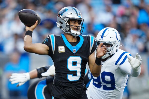 Carolina Panthers quarterback Bryce Young passes against the Indianapolis Colts during the first half of an NFL football game Sunday, Nov. 5, 2023, in Charlotte, N.C. (AP Photo/Jacob Kupferman)