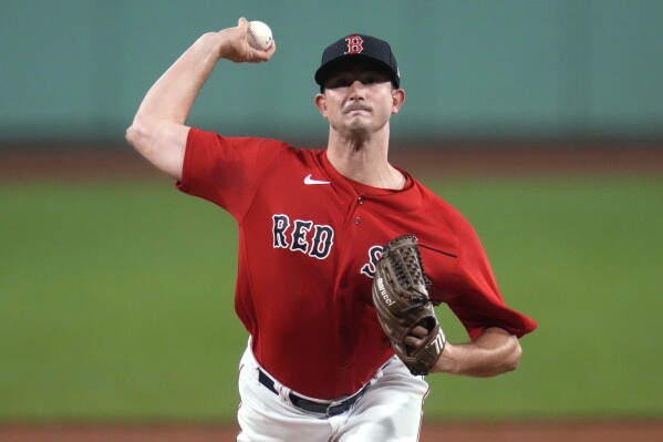Boston Red Sox starting pitcher Garrett Whitlock delivers in the first inning of the team's baseball game against the Colorado Rockies at Fenway Park, Wednesday, June 14, 2023, in Boston. (AP Photo/Charles Krupa)