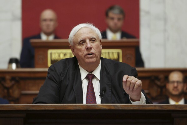 FILE - West Virginia Gov. Jim Justice delivers his annual State of the State address in the House Chambers of the state Capitol, Jan. 11, 2023, in Charleston, W.Va. On Wednesday, Dec. 13, Justice appointed a member of his cabinet to a circuit judge position and replaced him with one of his senior advisors. (AP Photo/Chris Jackson, File)