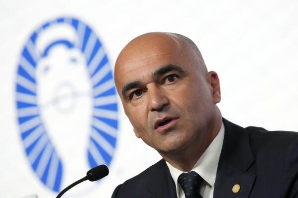 FILE - Portugal soccer coach Roberto Martinez answers questions after announcing the squad for the Euro 2024 at the federation headquarters in Oeiras, outside Lisbon, Tuesday, May 21, 2024. The European Championship represents an opportunity for player Cristiano Ronaldo to remind soccer fans that he is still a force in the game. Portugal coach Roberto Martinez, who was hired weeks after the World Cup, has retained the 39-year-old Ronaldo as captain. (AP Photo/Armando Franca, File)