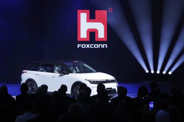 Foxconn's Foxtron Model C electric car is displayed during the Hon Hai Tech Day (HHTD 24) at the Nangang Exhibition Center in Taipei, Taiwan, Oct. 8, 2024. (AP Photo/Chiang Ying-ying, File)