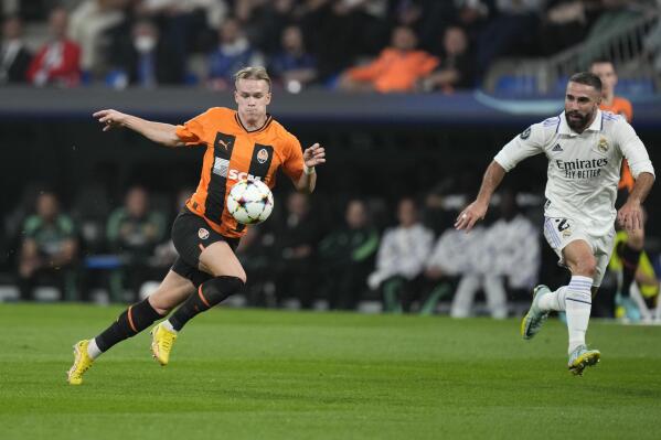 FILE - Shakhtar's Mykhaylo Mudryk, left, run with the ball next to Real Madrid's Dani Carvajal during the Champions League group F soccer match between Real Madrid and Shakhtar Donetsk at the Santiago Bernabeu stadium in Madrid, on Oct. 5, 2022. Shakhtar Donetsk's chief executive acknowledges it will be tough to win a $42 million claim for compensation from FIFA at the Court of Arbitration for Sport. (AP Photo/Bernat Armangue, File)