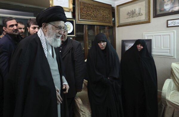 In this picture released by the official website of the office of the Iranian supreme leader, Supreme Leader Ayatollah Ali Khamenei meets family of Iranian Revolutionary Guard Gen. Qassem Soleimani, who was killed in the U.S. airstrike in Iraq, at his home in Tehran, Iran, Friday, Jan. 3, 2020. Iran has vowed "harsh retaliation" for the U.S. airstrike near Baghdad's airport that killed Tehran's top general and the architect of its interventions across the Middle East. (Office of the Iranian Supreme Leader via AP)