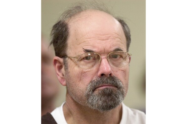 FILE - Convicted BTK killer Dennis Rader listens during a court proceeding, Oct. 12, 2005, in El Dorado, Kan. On Wednesday, Aug. 23, 2023, authorities in Oklahoma and Missouri said they are investigating whether the BTK serial killer was responsible for other homicides, with their search leading them to dig on Tuesday, Aug. 22, near his former Kansas property. (Travis Heying/The Wichita Eagle via AP, Pool, File)