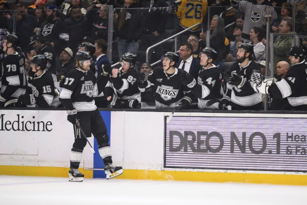 Los Angeles Kings left wing Warren Foegele (37) celebrates after scoring a goal during the first period of an NHL hockey game against the Boston Bruins, Sunday, March 23, 2025, in Los Angeles. (AP Photo/William Liang)