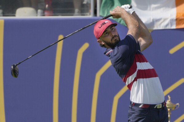 FILE - United States' Max Homa plays his shot off the 1st hole during his singles match at the Ryder Cup golf tournament at the Marco Simone Golf Club in Guidonia Montecelio, Italy, on Oct. 1, 2023. After his longest break from golf and then time spent on safari, Max Homa felt anxious about the state of his game heading into the Nedbank Golf Challenge in South Africa. He needn’t have worried. Homa holed a 16-foot birdie putt on No. 18 to shoot 6-under 66 on Thursday Nov. 9, 2023. (AP Photo/Alessandra Tarantino, File)