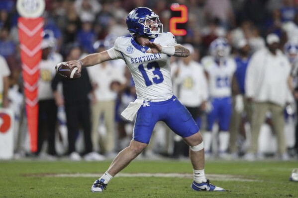 Kentucky quarterback Devin Leary (13) throws a pass during the second half of an NCAA college football game against South Carolina on Saturday, Nov. 18, 2023, in Columbia, S.C. (AP Photo/Artie Walker Jr.)