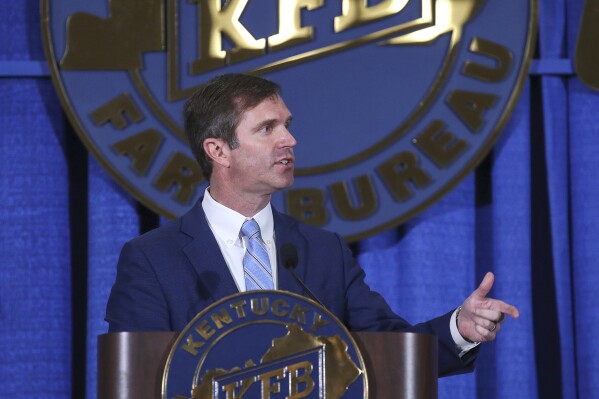 Gov. Andy Beshear speaks at the Kentucky Farm Bureau annual Country Ham Breakfast at the Kentucky State Fair on Thursday, Aug. 24, 2023, in Louisville, Ky. (Michael Clevenger/Courier Journal via AP)